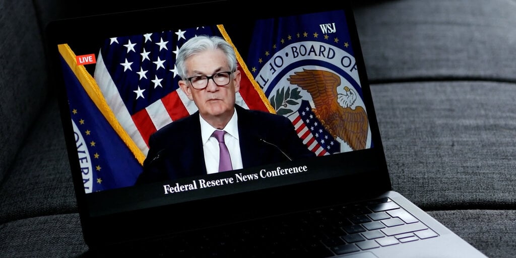 Bitcoin Rises as Fed Holds Rates Steady